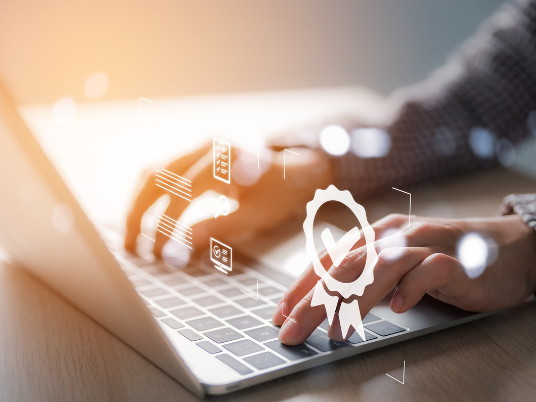 business woman's hand presses the laptop to assess customer satisfaction scores, service, give a high 5-star satisfaction rating